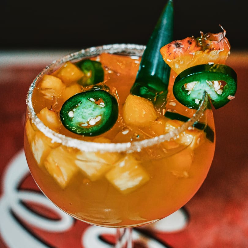 El Paso Tacos & Tequila's margarita with pineapple, jalapeños, and a salted rim.